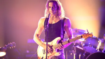 man holding guitar