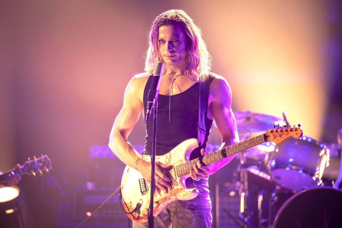 man holding guitar