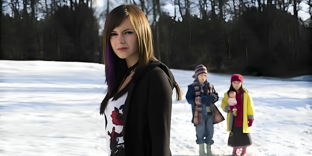 A teenage girl stands in the foreground while two young children stand in the background against a snow covered ground; a still from the movie The Children