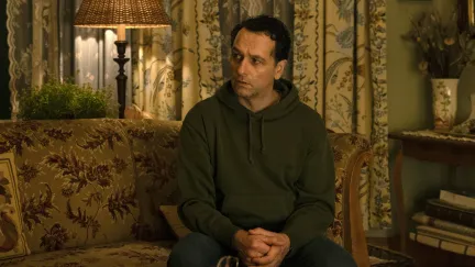 man sitting on couch
