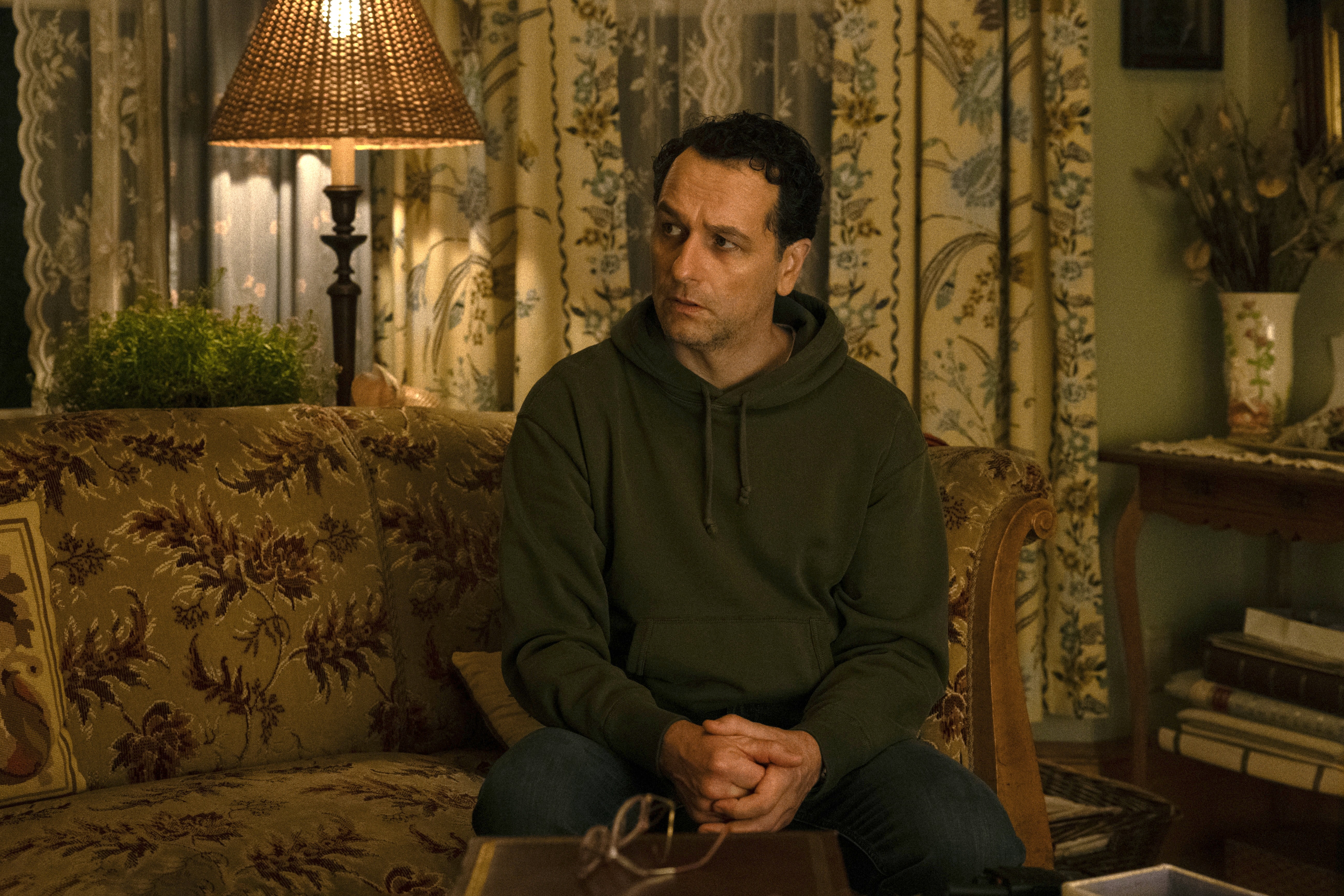 man sitting on couch