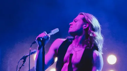 man singing on a microphone