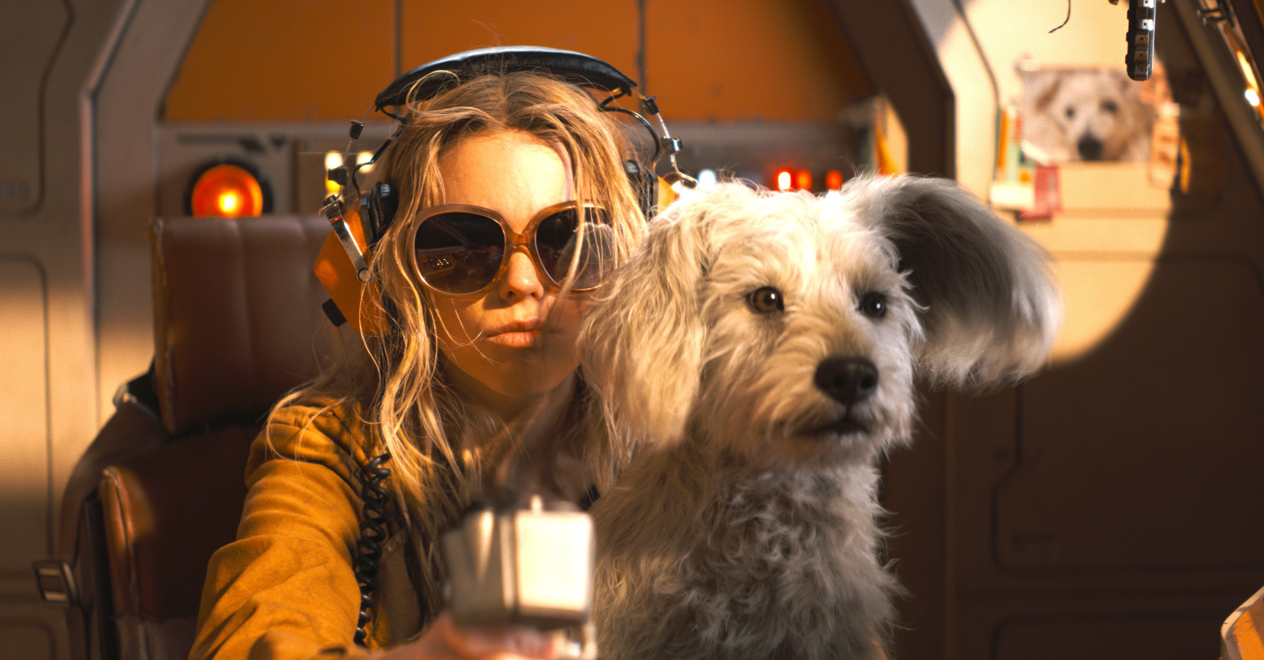 supergirl and a dog in a ship