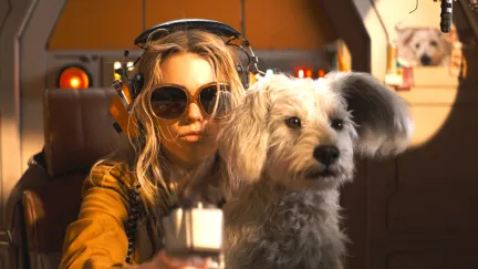 supergirl and a dog in a ship