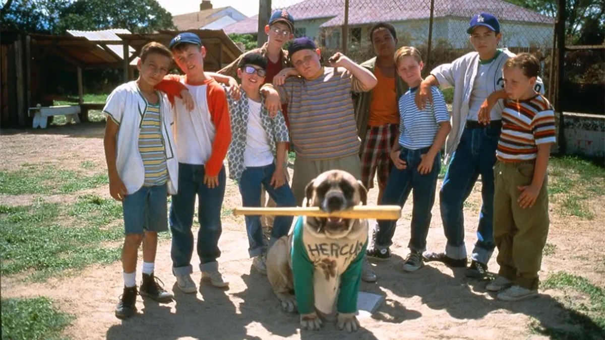 A kids' baseball team poses with a dog in The Sandlot