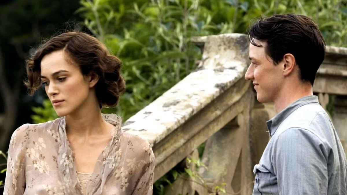 A man smiles at a woman turning away in "Atonement"