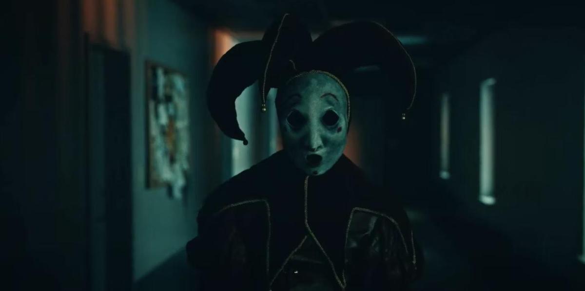 One of the monsters from the film "Tarot"; the figure appears as a creepy jester