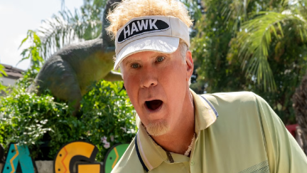 Man looking shocked wearing a golfing visor.