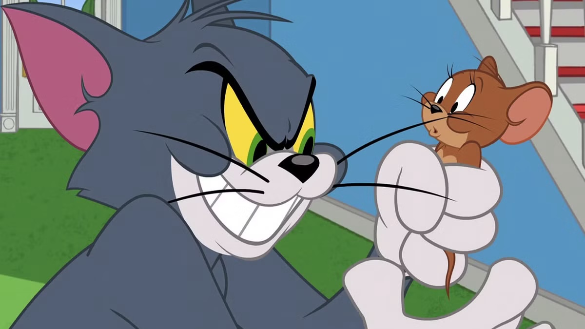 Tom grabs Jerry in Tom and Jerry