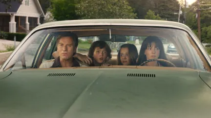 four people in a car