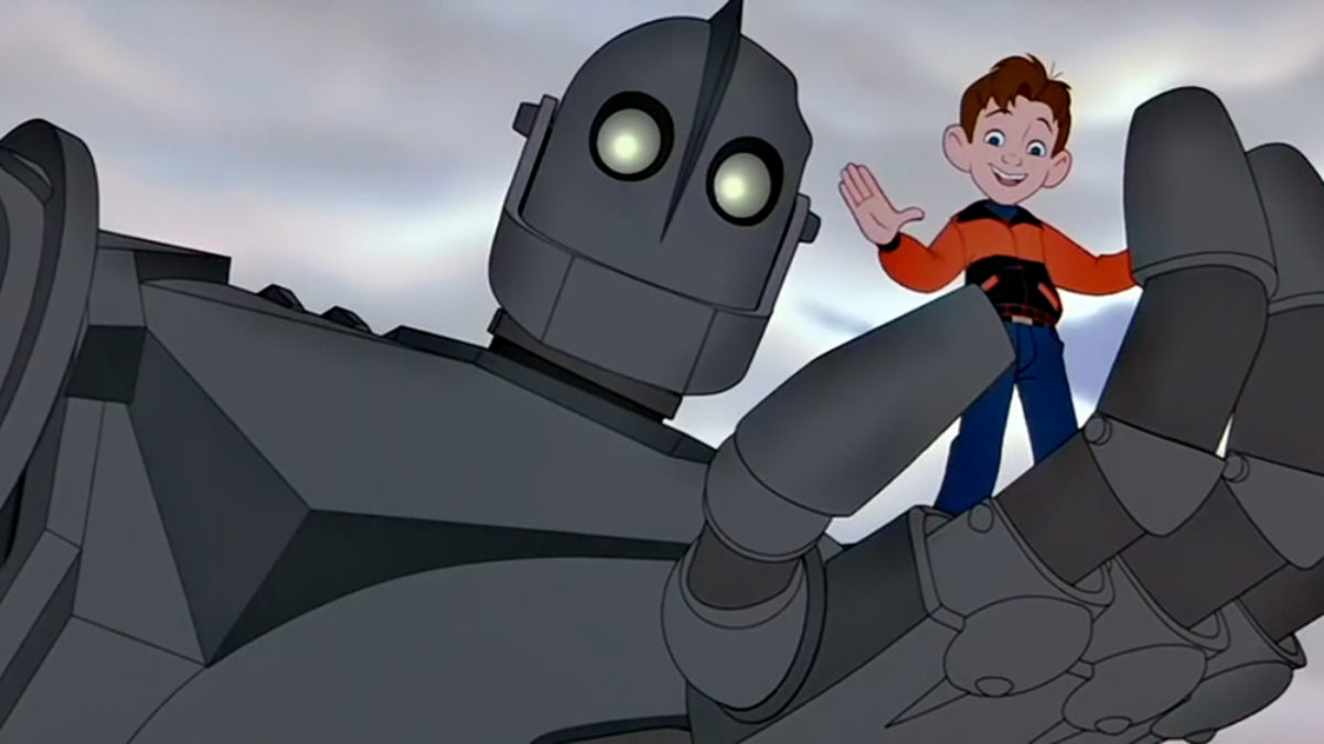 the iron giant holds a boy in his palm in "The Iron Giant"