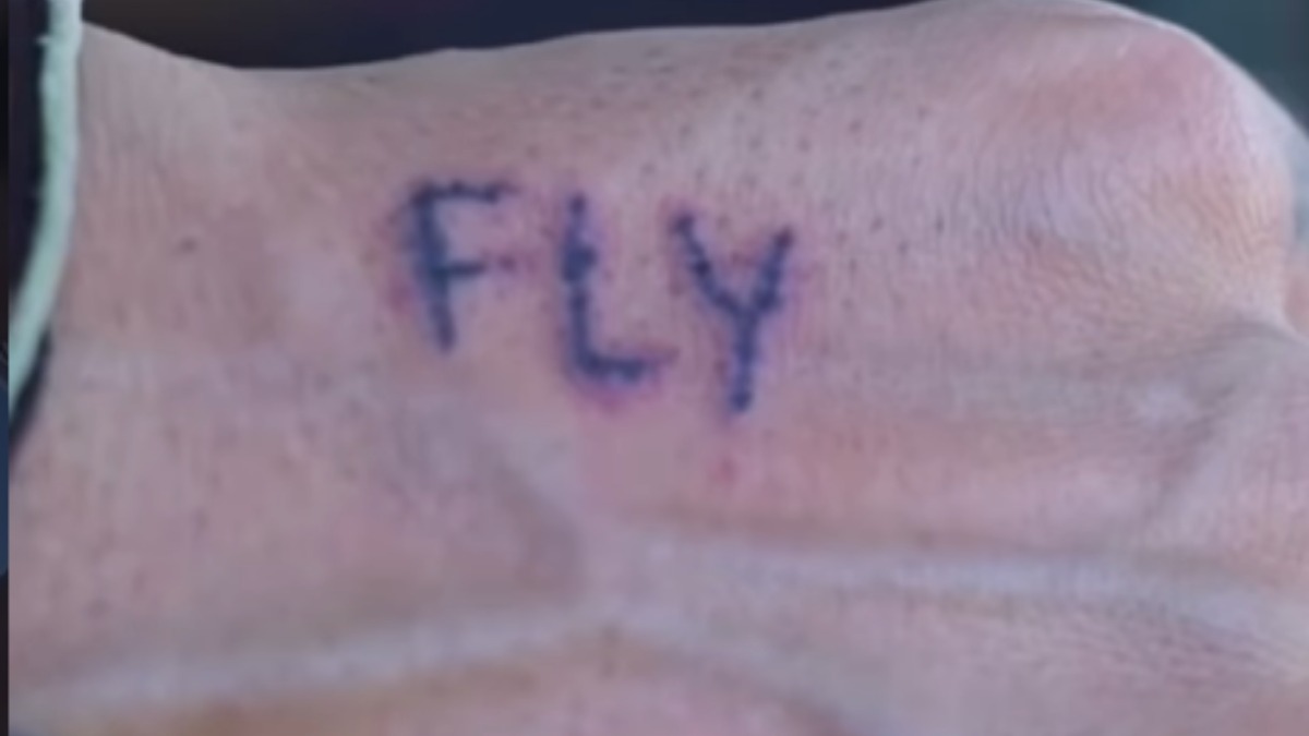 The word "fly" tattooed onto a hand