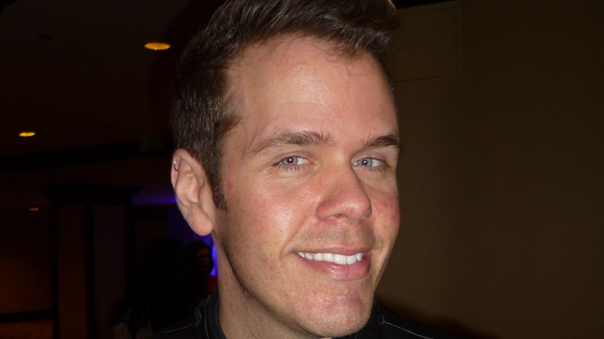 Perez Hilton smiling in a publicity photo
