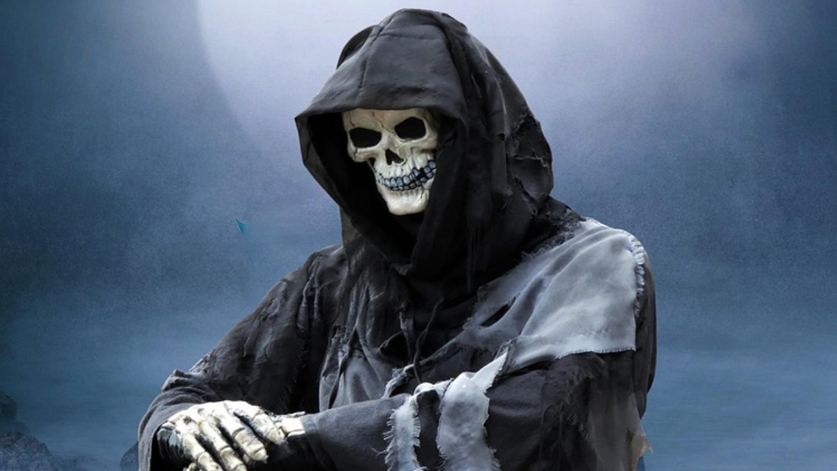 The Grim Reaper resting on a scythe in the moonlight