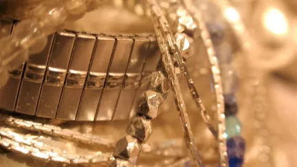 A pile of gold bracelets
