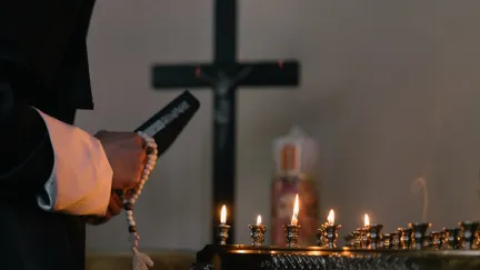 Priest With Religious Objects