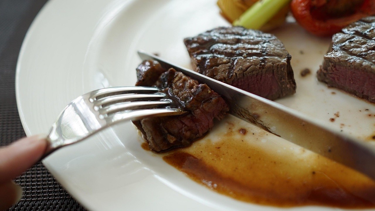 Steak on a Plate being Cut