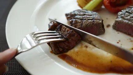 Steak on a Plate being Cut